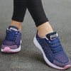 Cushioned white athletic footwear with playful multi-color trim