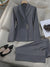 Tailored power suit in navy blue, made from a premium polyester-spandex blend for comfort and style.