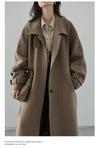 Contemporary belted coat in wool blend with refined turtleneck collar