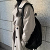 Men's long double-breasted trench coat with turn-down collar, perfect for autumn and winter streetwear and casual style.