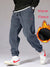 Person wearing thermal corduroy joggers with sneakers for casual comfort