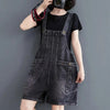 Model wearing vintage-inspired denim suspender jumpsuit demonstrating relaxed comfortable fit and drape