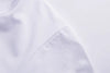 White graphic tee with motivational slogan styled with jeans for casual everyday wear