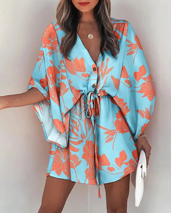 Full length view of above-knee floral dress with whimsical irregular ruffle hem