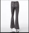 Bohemian flare leg pants for women in vibrant floral print, perfect for casual or festival wear in spring and summer.