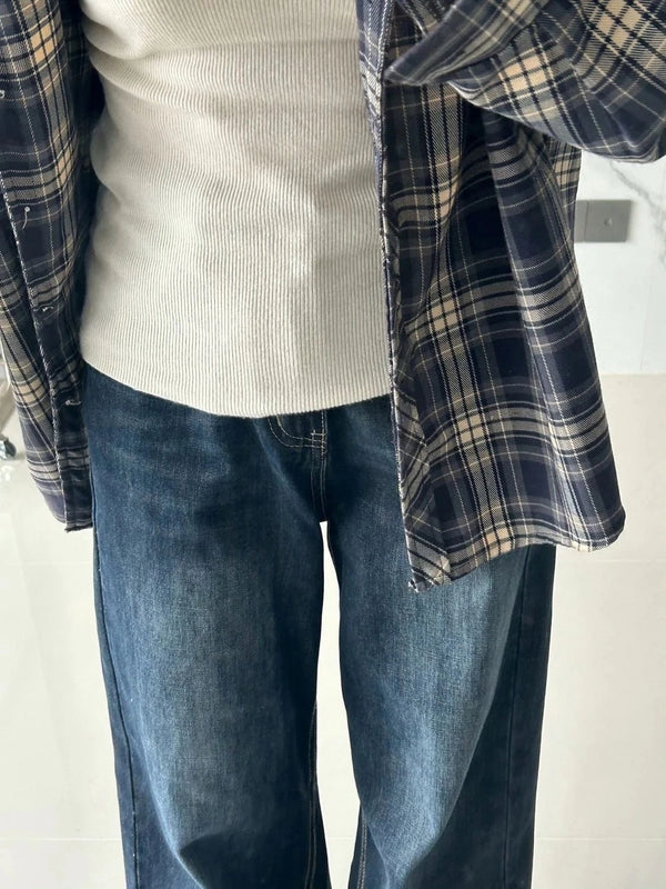 Classic Y2K style straight leg denim jeans with zipper fly closure and practical pocket details