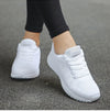 Women's white casual sneakers with colorful accents and cushioned insole