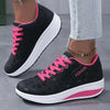 Platform wedge sneakers featuring lace-up closure and breathable design
