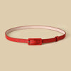 Chic skinny faux leather belt for women in vibrant red, perfect for casual and dressy outfits, featuring a vintage buckle.