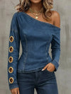 Asymmetric denim top with metal ring cutout detail and skew collar in blue broadcloth fabric