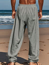 Casual linen trousers with adjustable drawstring and flowing wide leg design
