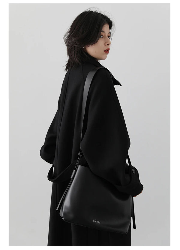 Sophisticated belted outerwear featuring turtleneck and streamlined silhouette