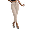 Woman in straight leg trousers paired with cropped sweater for casual elegant style