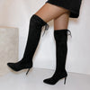 Tall lace-up boots with premium suede finish and elongating slim heel design for fall and spring wear