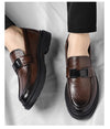 Close-up of the soft leather texture on men's dress loafers.