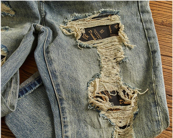 Close-up of the fabric texture on Rebel Spirit Distressed Jeans, showcasing quality material.