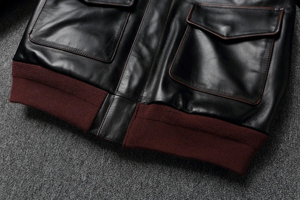 Close-up of the zipper pull on the Vintage A2 leather flight jacket.