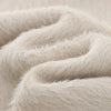 Creamy white mohair blazer on hanger showing full length and tailored silhouette
