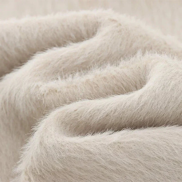 Creamy white mohair blazer on hanger showing full length and tailored silhouette