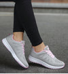 White sports sneakers with breathable mesh and vibrant color pops