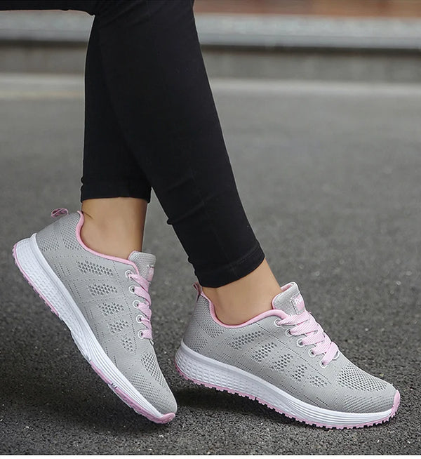 White sports sneakers with breathable mesh and vibrant color pops