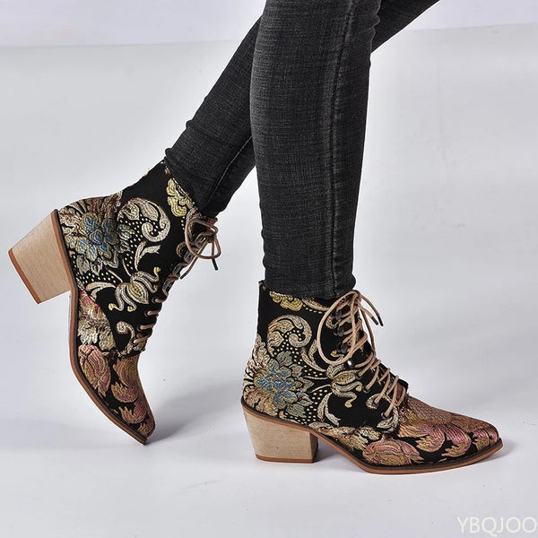 Elegant embroidered ankle boots with botanical motifs and versatile neutral tone