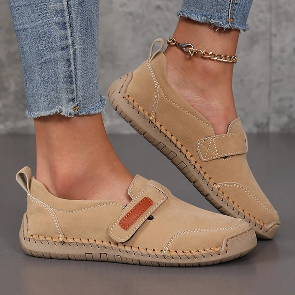 Side view of slip-on leather loafers featuring clean design and comfortable low heel