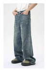 Men's relaxed wide leg jeans in washed blue with zipper front closure
