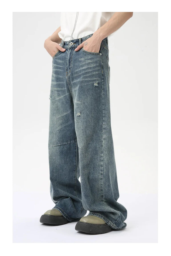 Men's relaxed wide leg jeans in washed blue with zipper front closure