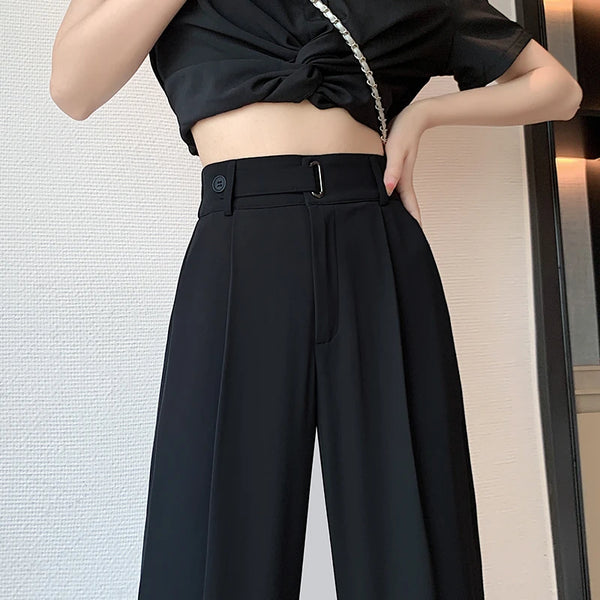 Timeless black wide leg trousers showcasing flattering high-rise waist and flowing drape