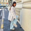 Back view of creamy white mohair blazer showing shoulder construction and regular fit design