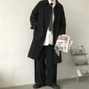 Chic Japanese vintage trench coat for men in black, featuring a single-breasted closure and stylish turn-down collar.