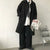 Chic Japanese vintage trench coat for men in black, featuring a single-breasted closure and stylish turn-down collar.