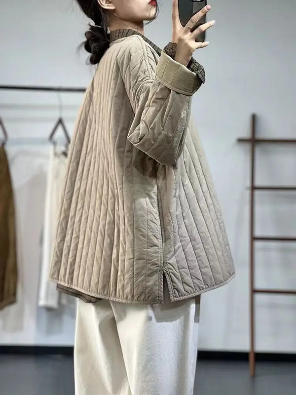 Khaki quilted jacket layered over sweater demonstrating versatile fall styling options