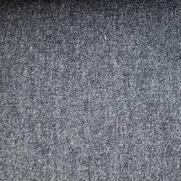 Detail shot of the two-button closure on the blue-grey flannel suit jacket.