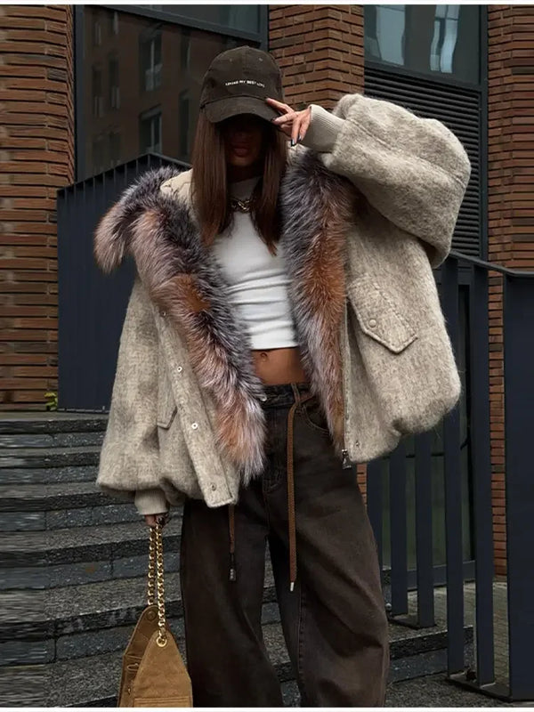 Close-up of distressed edgy detailing on plush hooded jacket