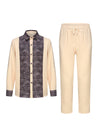 Colorful patchwork African print shirt with matching pants featuring bold geometric patterns and cultural motifs