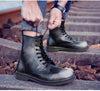 Waterproof leather boots with a classic black finish.