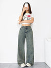 Side view of jeans highlighting the flowy silhouette and vintage detailing.
