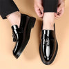 Professional black tassel loafers with lustrous finish and comfortable round toe for boardroom to evening wear