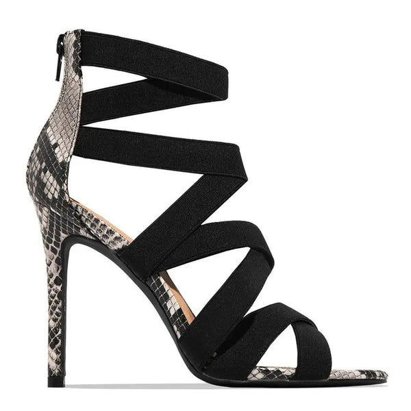 Trendy burgundy stiletto sandals featuring a sleek design and open toe.