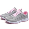 Breathable white athletic shoes with playful multi-color design elements