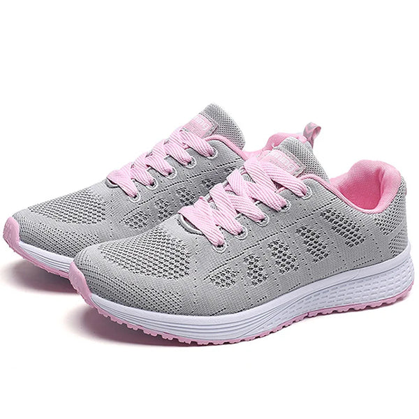 Breathable white athletic shoes with playful multi-color design elements