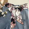Chic fabric belt for women with geometric design, versatile for dresses, jeans, or as a scarf and headband accessory.
