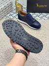 Side view of black leather loafers for men, slip-on design.