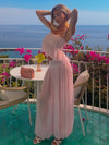 Wide-leg trousers paired with intricate lace sleeveless top for summer events