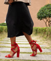 Chic white open-toe stiletto sandals with a durable rubber outsole.