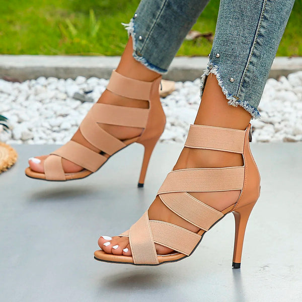 Elegant coral stiletto sandals with a true to size fit and ankle-wrap.