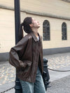 Chic genuine leather jacket for women, zippered blazer, tailored fit, perfect for autumn and winter casual or formal wear.