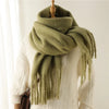 Chic cashmere-feel scarf in soft mint green with elegant design.
